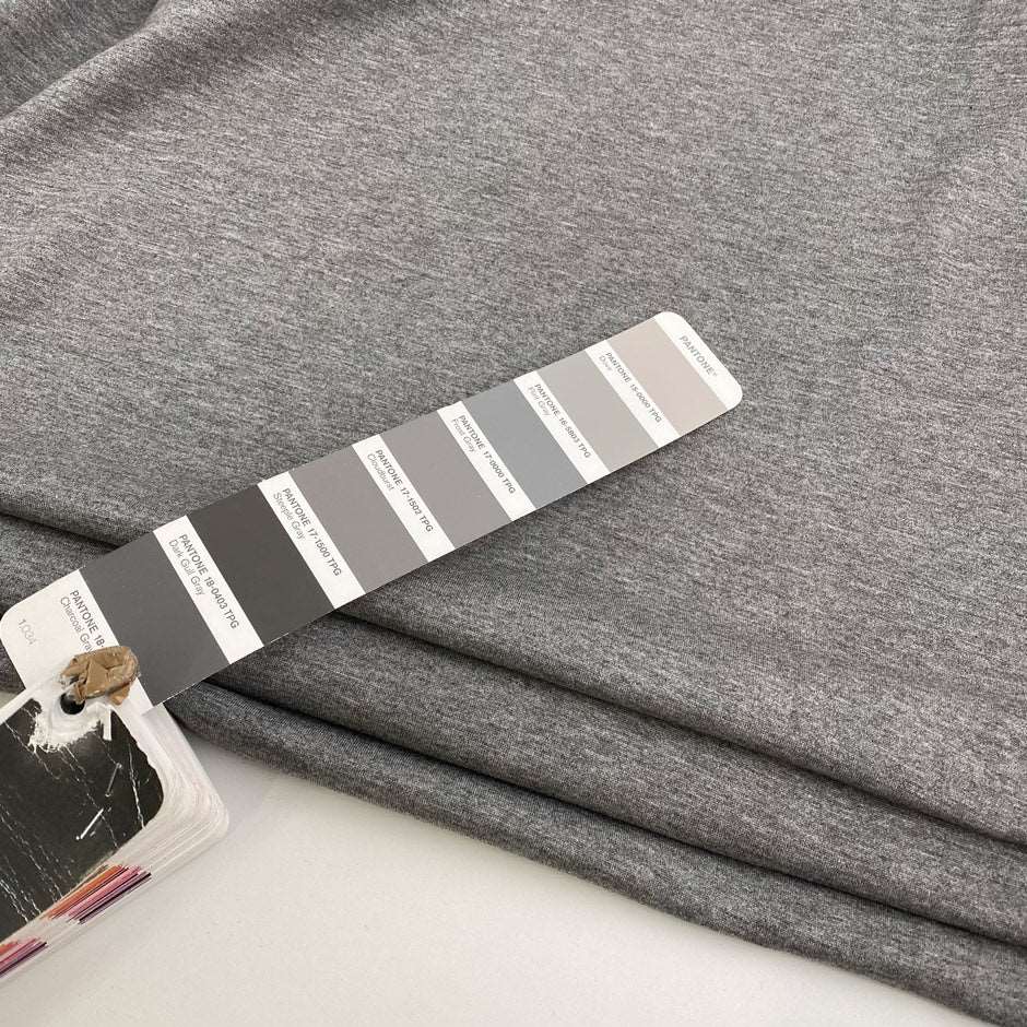 Grey melange polyester stitch milano jersey. High quality deadstock fabric.