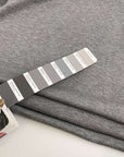 Grey melange polyester stitch milano jersey. High quality deadstock fabric.