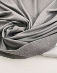 Grey melange polyester stitch milano jersey. High quality deadstock fabric.