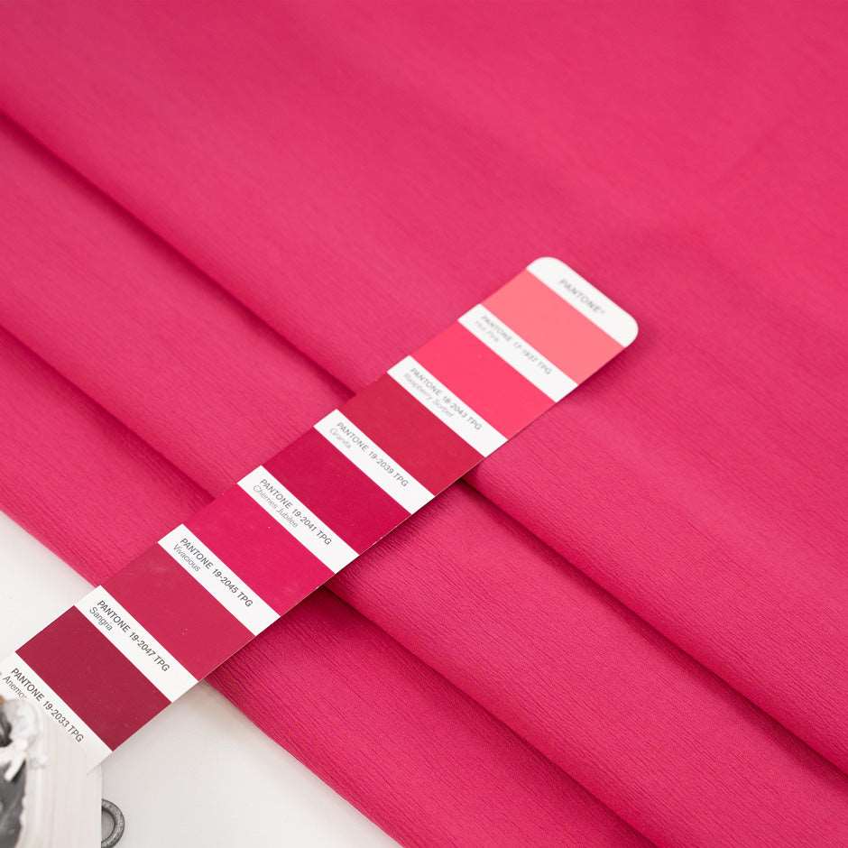 Soft and comfort silk crepe fabric in fuchsia. High quality deadstock fabric