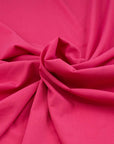 Soft and comfort silk crepe fabric in fuchsia. High quality deadstock fabric