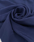 Crepe de chine in acetate and silk in navy blue. It is very light, soft, and structured. High-quality deadstock fabric by the meter collected in Stock from a Maison de Couture in Italy.