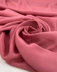 Silk and acetate crepe de chine in dark pink, very light and soft. High-quality deadstock fabric by the meter collected in Stock from a Maison de Couture in Italy.