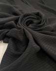 Black structured silk and acetate jacquard. High-quality deadstock fabric collected in Stock from a Maison de Couture in Italy.