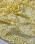Polyester lace in limelight yellow with double scallop. Light and decorative, ideal for dresses, blouses, and skirts. High-quality deadstock collected in Stock from a Maison de Couture in Italy.