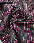 Pure cotton poplin with tartan design in the shades of dark green, red and yellow. Crunchy, flowy and not transparent. Ideal for shirts, dresses and skirts. High-quality deadstock collected in Stock from a Maison de Couture in Italy.