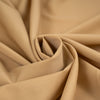 Wool and polyester elasticized camel color soft fabric. High-quality deadstock collected in Stock from a Maison de Couture in Italy. Wool and polyester elasticized camel color soft fabric. High-quality deadstock collected in Stock from a Maison de Couture in Italy.