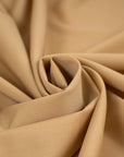 Wool and polyester elasticized camel color soft fabric. High-quality deadstock collected in Stock from a Maison de Couture in Italy.