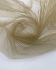 Soft and transparent polyester micro tulle beige. High-quality deadstock fabric collected in Stock from a Maison de Couture in Italy.