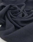 Blend of virgin wool, polyamide and linen in dark blue and black. High quality deadstock fabric.