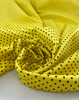 Pure cotton light gabardine with very bright yellow ground and black polka dots design. very soft medium weight. Ideal for dresses, skirts and shirts.High-quality deadstock collected in Stock from a Maison de Couture in Italy.