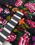 Pure viscose with floral design in panels. The ground is black and the print is in the shades of green, orange, dark red, and fuchsia. Very soft, light, and flowy. Ideal for dresses, skirts, and blouses. High-quality deadstock collected in Stock from a Maison de Couture in Italy.