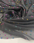 Transparent fil coupé in black background polyester. High-quality deadstock fabric by the meter collected in Stock from a Maison de Couture in Italy.