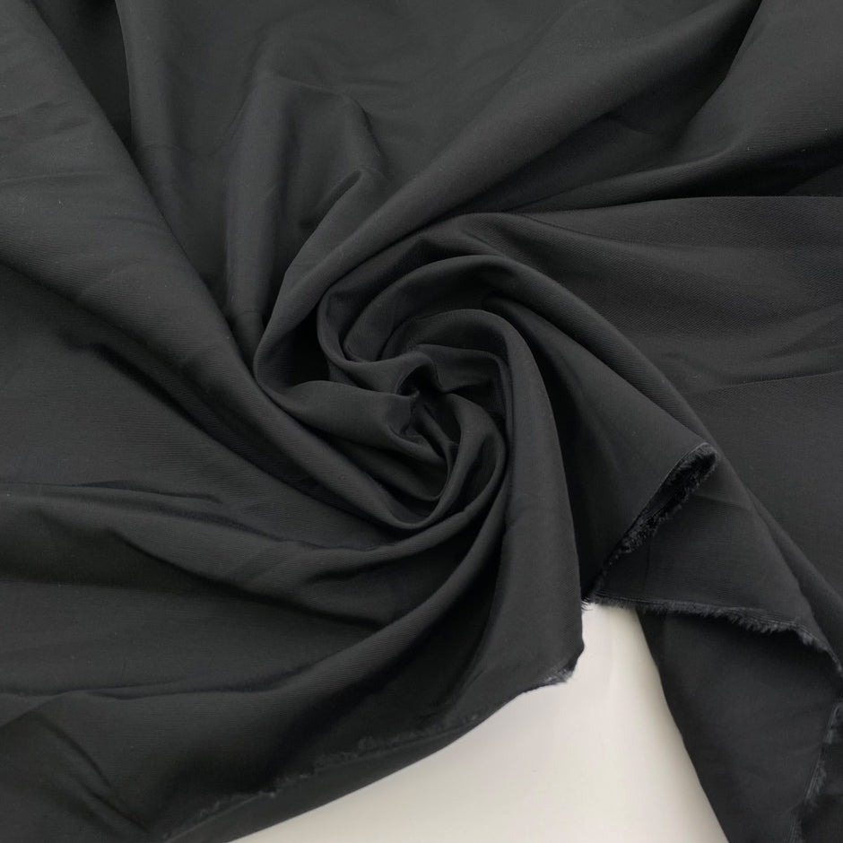 Black viscose ottoman