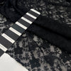 Viscose and polyester stretch light lace in black, flower design. High-quality deadstock fabric collected in Stock from a Maison de Couture in Italy. Viscose and polyester stretch light lace in black, flower design. High-quality deadstock fabric collected in Stock from a Maison de Couture in Italy.