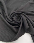 Jacquard stripe of wool-polyester blend, soft and falling black color. High quality deadstock fabric collected in Stock from a Maison de Couture in Italy.