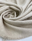 Mixed wool and cotton cream-colored, boucle fabric. It is heavy and falling. High-quality deadstock fabric collected in Stock from a Maison de Couture in Italy.