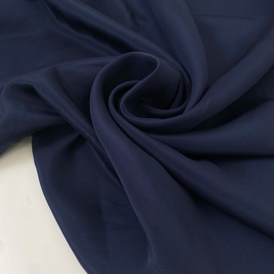 Blue viscose and polyester, color reference oceana. Very soft, flowy, and a little shiny. Ideal for trousers, dresses, skirts, and soft jackets.  High-quality deadstock collected in Stock from a Maison de Couture in Italy.