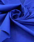 Pure cotton poplin in bright blue, very soft and not transparent, ideal for shirts, dresses, and casual garments. High-quality deadstock collected in Stock from a Maison de Couture in Italy.