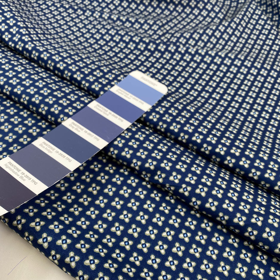 Pure cotton popeline with a blue ground and small flower design in the shades of beige. very soft and light. High-quality deadstock fabric by the meter collected in Stock from a Maison de Couture in Italy.