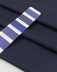 Pure virgin wool in dark blue with a subtle textured micro square design. Very soft, light, and not transparent. Ideal for shirting, dresses, and lightweight garments. High-quality deadstock collected in Stock from a Maison de Couture in Italy.