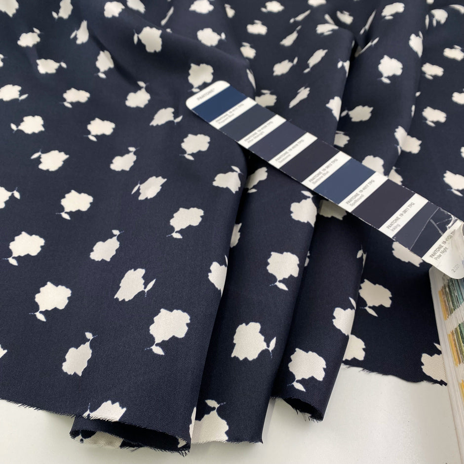 Pure printed silk twille blue and white. Falling, light and floral. High-quality deadstock fabric by the meter collected in Stock from a Maison de Couture in Italy.