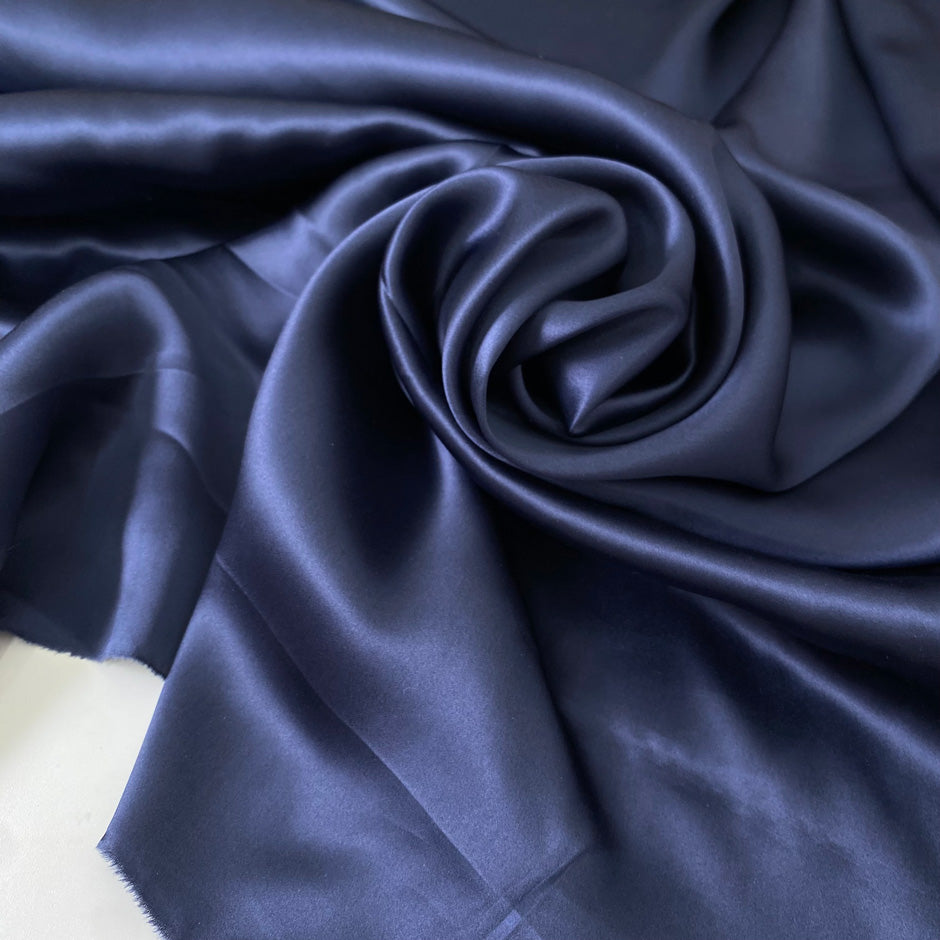 Elegant dark blue pure silk satin, soft and lightweight with a glossy finish. Not transparent, ideal for dresses, blouses, skirts, nightwear and lingerie.High-quality deadstock collected in Stock from a Maison de Couture in Italy.