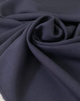 Soft and flowy virgin wool with elastane in dark blue. Not transparent and ideal for dresses, skirts, trousers, and jackets.
High-quality deadstock collected in Stock from a Maison de Couture in Italy.