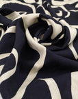 Pure viscose crepe in dark blue and beige shades, with a very big geometrical design. Very soft and light. High-quality deadstock fabric by the meter collected in Stock from a Maison de Couture in Italy.