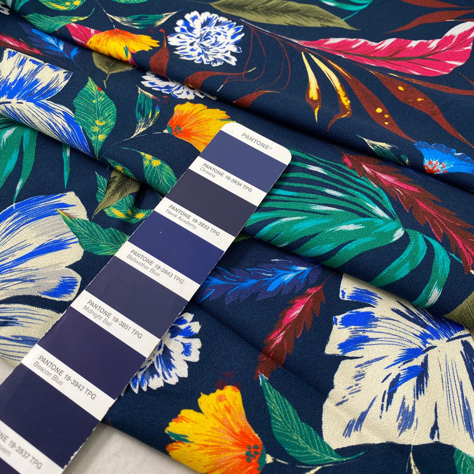Pure viscose printed with a multicolor tropical design. The ground is dark blue, color reference oceana. Very soft and flowy, ideal for dresses, trousers, skirts, and blouses. High-quality deadstock collected in Stock from a Maison de Couture in Italy.
