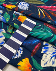 Pure viscose printed with a multicolor tropical design. The ground is dark blue, color reference oceana. Very soft and flowy, ideal for dresses, trousers, skirts, and blouses. High-quality deadstock collected in Stock from a Maison de Couture in Italy.