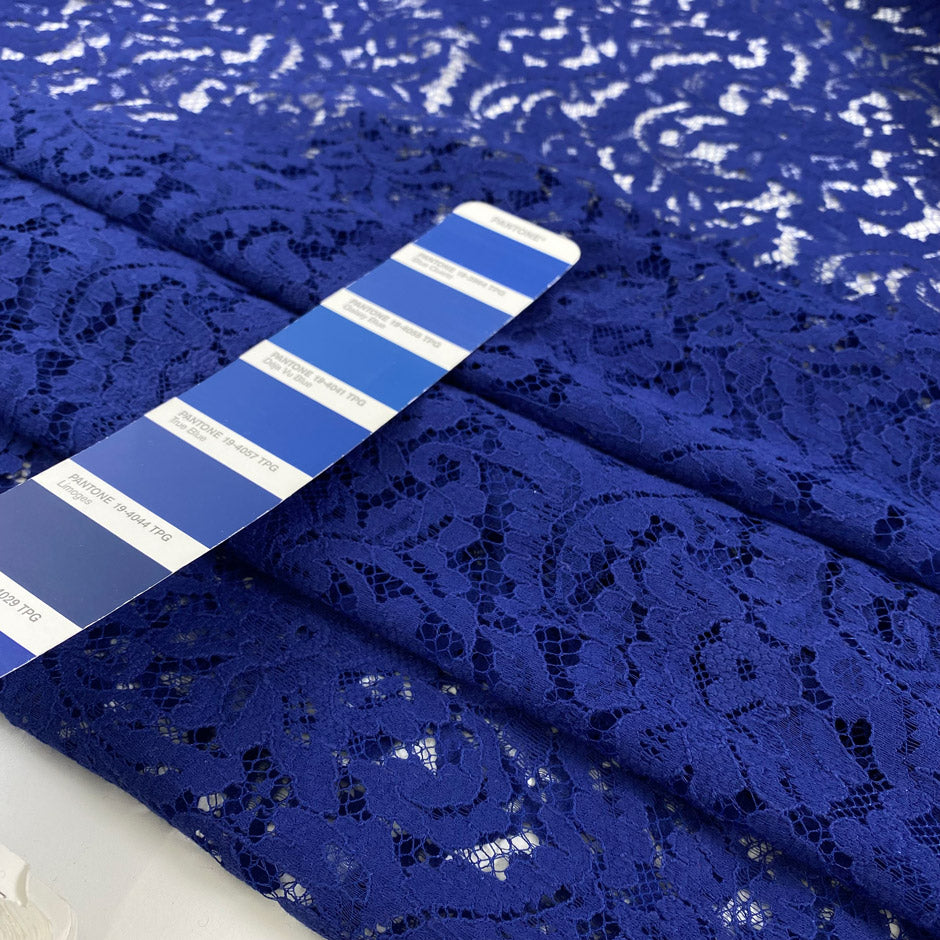 Blue viscose and polyester lace with double scalloped. Floral design very soft and light. High-quality deadstock fabric collected in Stock from a Maison de Couture in Italy.