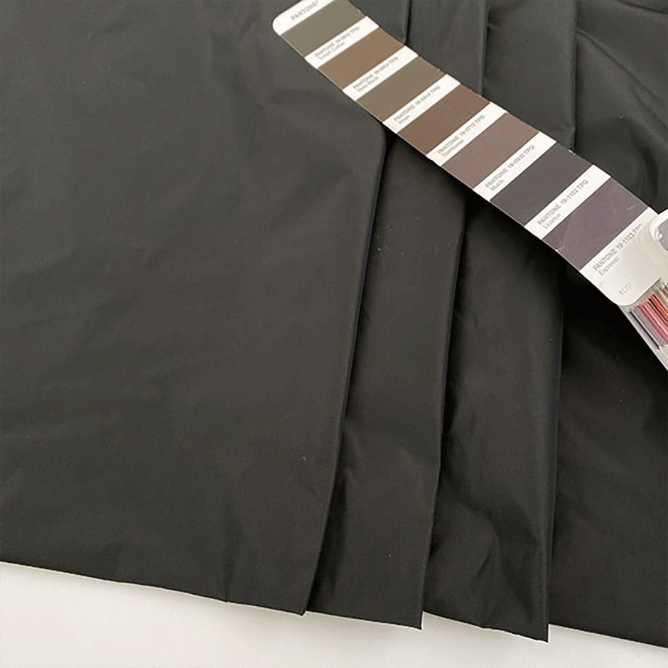 Solid color polyester fabric, textured gray and brown . High-quality deadstock fabric by the meter collected in Stock from a Maison de Couture in Italy.