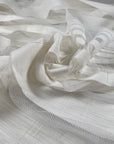 Jacquard net in cotton and polyester with striped design, in star white color. Very light and soft, transparent. Ideal for dresses, skirts, shirting, and blouses. High-quality deadstock collected in Stock from a Maison de Couture in Italy.
