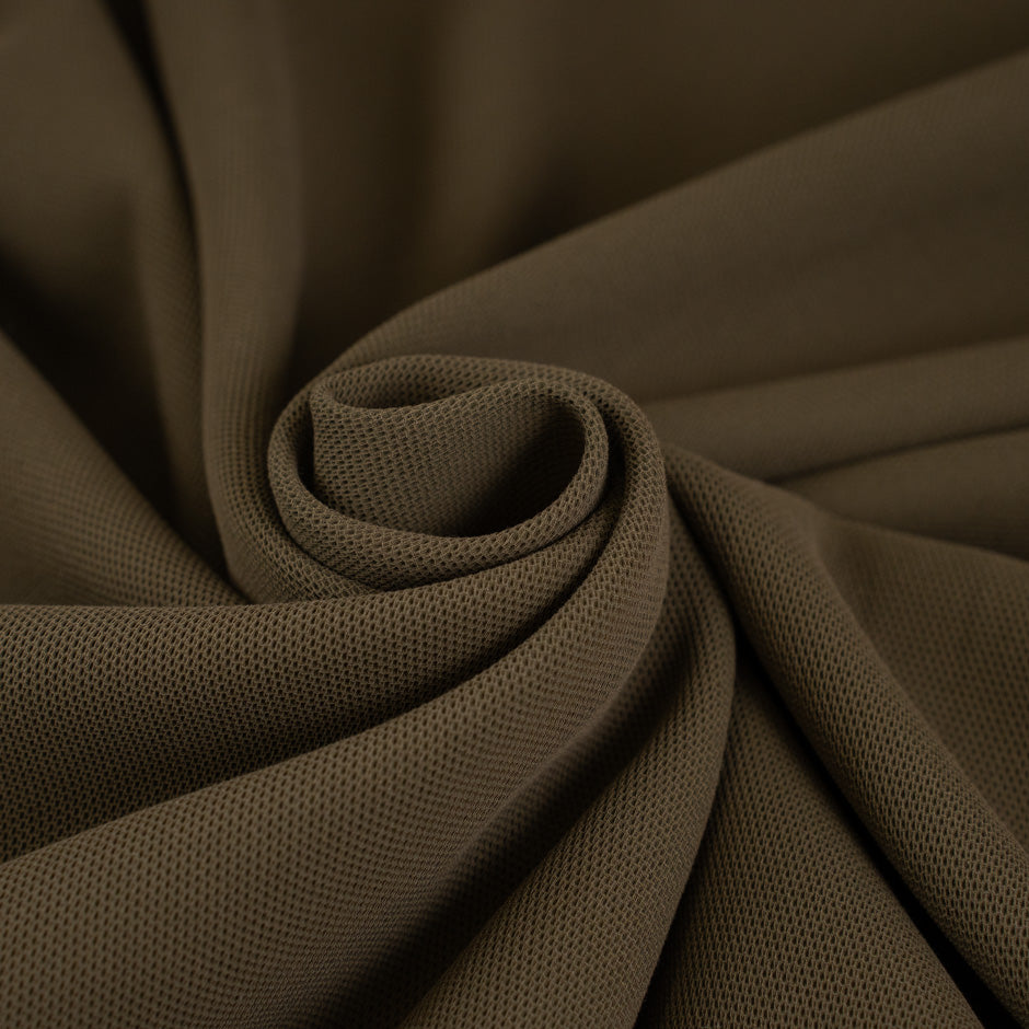 Green worked viscose cady falling and slightly elastic. High-quality deadstock fabric collected in Stock from a Maison de Couture in Italy.