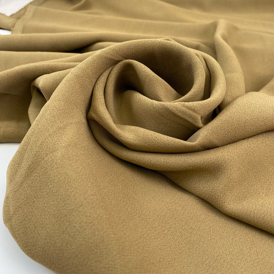 Plain cady stretch viscose in camel color. High-quality deadstock collected in Stock from a Maison de Couture in Italy.