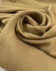 Plain cady stretch viscose in camel color. High-quality deadstock collected in Stock from a Maison de Couture in Italy.