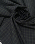Soft pure cotton poplin with a check pattern in green and dark blue. Comfortable and versatile, ideal for shirting and dresses.High-quality deadstock collected in Stock from a Maison de Couture in Italy.