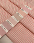 Cotton and polyester blend with stretch in a white and pink checked seersucker texture. Soft and fresh, ideal for dresses, skirts, trousers, and blouses.High-quality deadstock collected in Stock from a Maison de Couture in Italy.