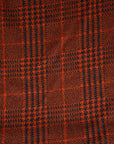 Prince of Wales knit of pure orange wool. The fabric is soft and strecthy. High quality deadstock fabric.