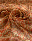 Pure silk chiffon with paisly design in paprika red and orange shades. Very soft, light and trasparent. High-quality deadstock fabric by the meter collected in Stock from a Maison de Couture in Italy.