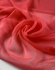 Polyester chiffon in coral paradise. Very soft and light, flowy and transparent. High-quality deadstock fabric by the meter collected in Stock from a Maison de Couture in Italy.