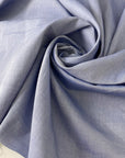 Pure cotton poplin in light blue color reference Eventide. Very soft and light, ideal for shirting, dresses and skirts. High-quality deadstock collected in Stock from a Maison de Couture in Italy.