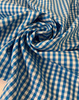 Pure cotton poplin in blue with a small check design (square size approx. half a centimeter). Very soft, light, and not transparent—ideal for shirts, dresses, and skirts. High-quality deadstock collected in Stock from a Maison de Couture in Italy.