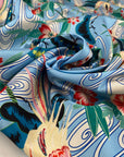Polyester satin with floral design in the shades of blue, white, light blue, green and red. Very soft, light and flowy. High-quality deadstock fabric collected in Stock from a Maison de Couture in Italy.