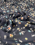 Pure silk with a subtle sheen and small floral design, dark blue base, slightly transparent. Ideal for blouses, dresses, and delicate layers. High-quality deadstock collected in Stock from a Maison de Couture in Italy.