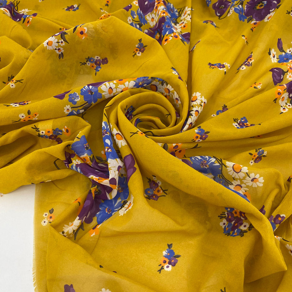 Pure cotton voile with an ochre base and floral print in violet, light blue, white, and orange. Soft, light, and slightly transparent. Ideal for dresses, skirts, and shirting.
High-quality deadstock collected in Stock from a Maison de Couture in Italy.