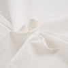 White and stretch technical polyester. High-quality deadstock fabric collected in Stock from a Maison de Couture in Italy. White and stretch technical polyester. High-quality deadstock fabric collected in Stock from a Maison de Couture in Italy.