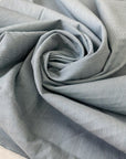 Stretch cotton fabric with a fine striped pattern in light blue. Very soft and light, ideal for shirts, dresses, and skirts. High-quality deadstock collected in Stock from a Maison de Couture in Italy.