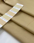 Stretch cotton piqué in very light camel color, with structured textured and very soft. High-quality deadstock fabric by the meter collected in Stock from a Maison de Couture in Italy.